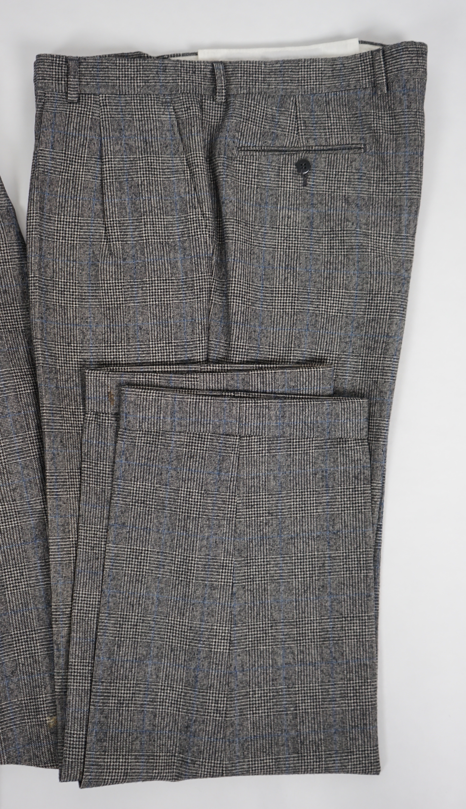 A Yves Saint Laurent rive gauche gentlemen's Prince of Wales check double breasted wool suit, approx size 42